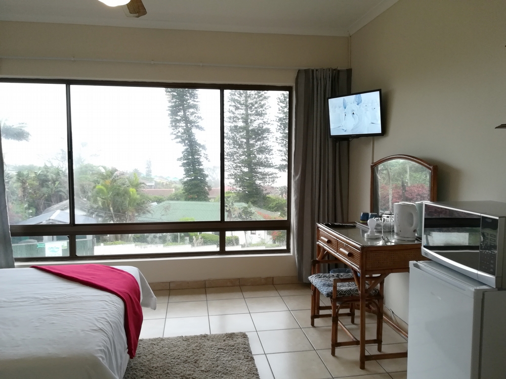 Rockview Guest House Each bedroom has a flat screen TV, open view, a bar fridge and microwave.